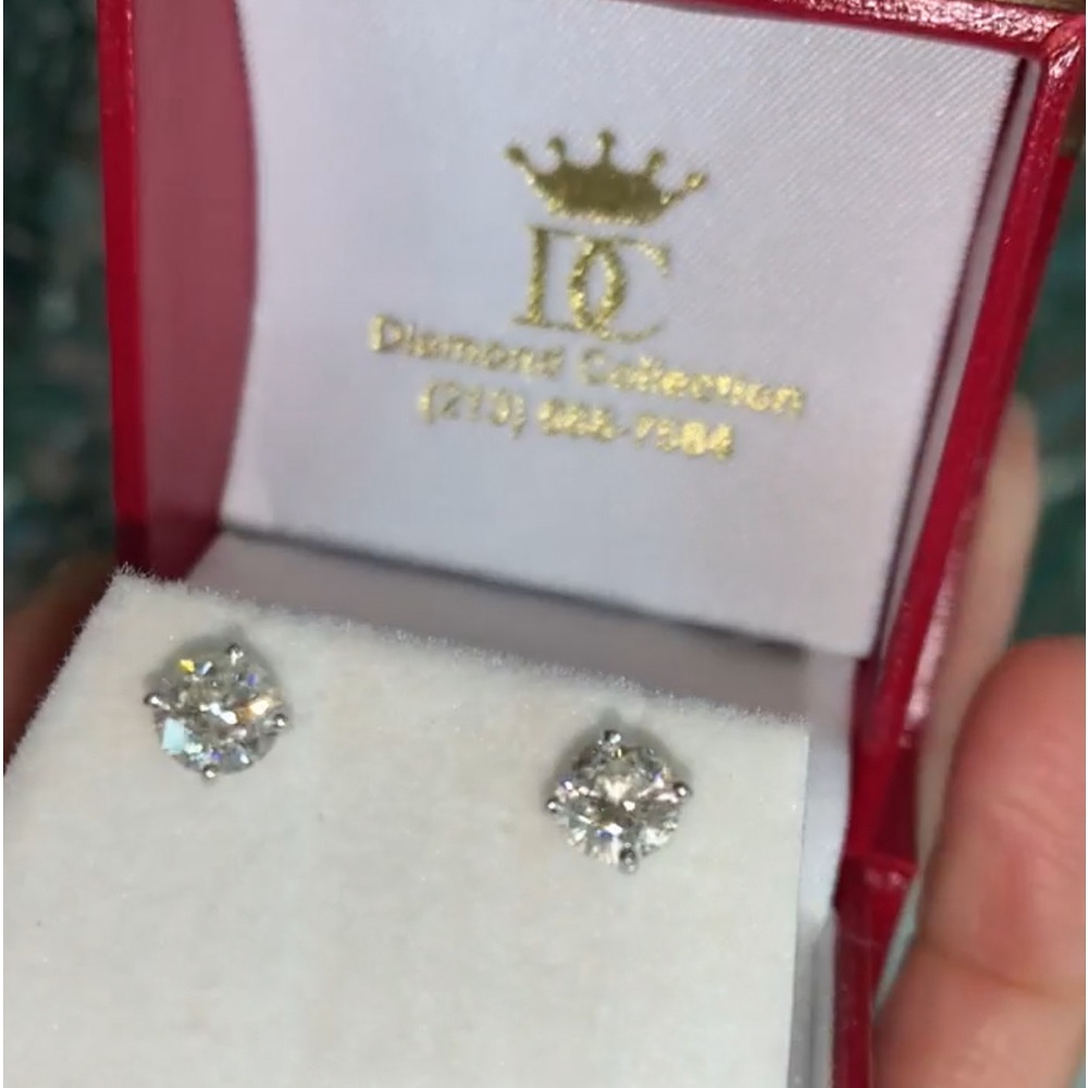 14KT White gold diamond earrings.Total 1.37 carats G color. SI clarity .68 each